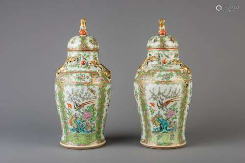 A pair of Chinese Canton famille rose vases and covers,
