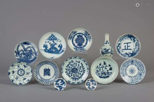 Eleven Chinese blue and white plates and a vase for the