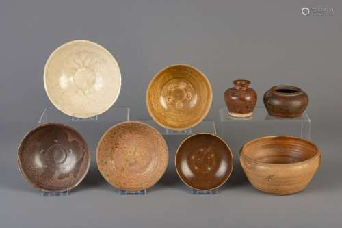 Seven Vietnamese glazed bowls and a vase, one of which