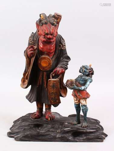 AN EDO / MEIJI PERIOD JAPANESE WOOD & LACQUERED OKIMONO OF ONI NO NENBUTSU, the figures stood upon a