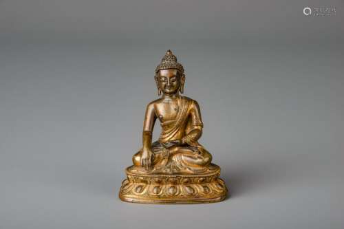 A Sino-Tibetan gilt bronze figure of Buddha, 18th/19th
