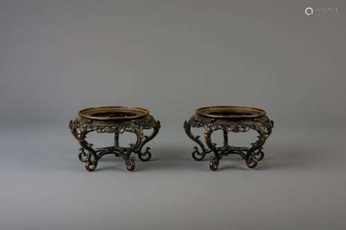 A pair of Chinese bronze open worked stands,