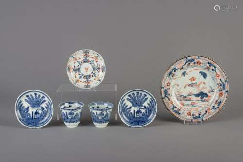 A pair of Chinese blue and white cups and saucers and