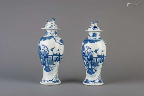 A pair of Chinese blue and white vases and covers with
