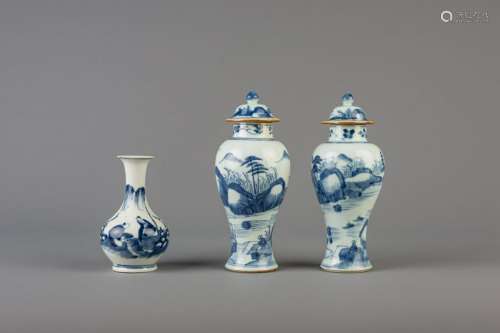 A pair of Chinese blue and white vases and covers and a