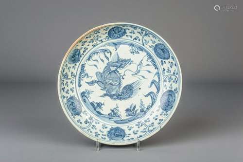 A Chinese blue and white charger with floral design and