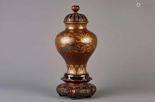 An imitation bronze porcelain vase with a wood cover