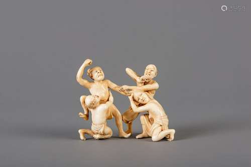 A Japanese carved ivory 'trouble in paradise' group,