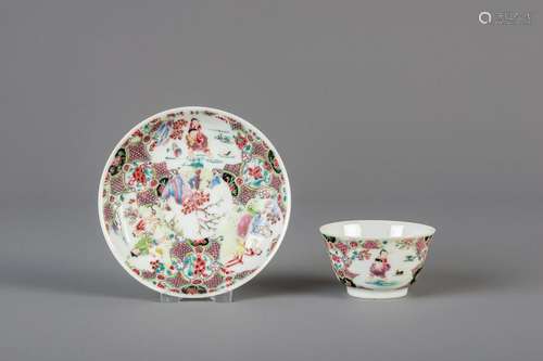 A Chinese famille rose cup and saucer with figures,