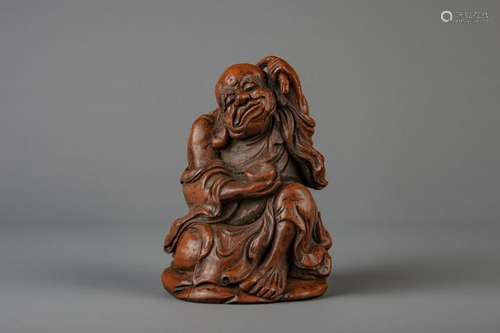 A Chinese bamboo carving of a Buddha, 19th C.