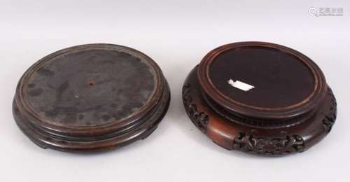 TWO CHINESE CARVED HARDWOOD CIRCULAR STANDS, for vases with a diameter of 9.5 & 7.5