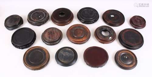 A MIXED LOT OF FIFTEEN CHINESE HARDWOOD STANDS, for vases ranging from 4