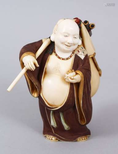 A JAPANESE MEIJI PERIOD CARVED IVORY AND POLY CHROME DECORATED OKIMONO OF HOTEI, he is stood in