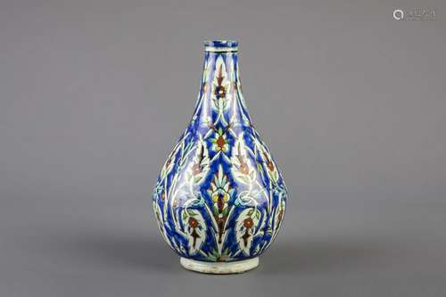 A Kutahya Iznik style bottle vase with floral design,