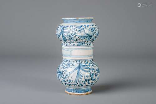 An Italian blue and white albarello with floral design,