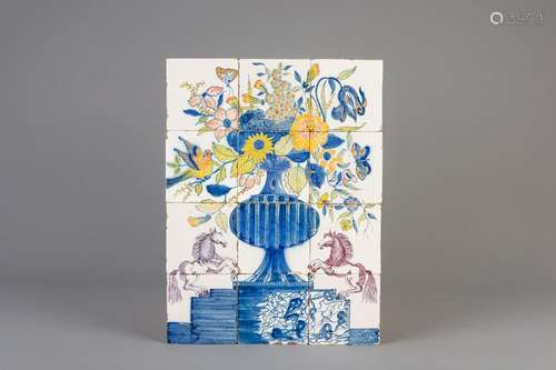 A polychrome Dutch Delft tile mural with a flower vase,