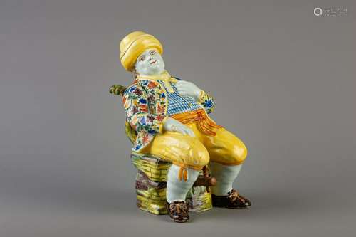 A Dutch Delft polychrome figural 'Bobbejak' table