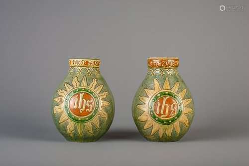 A pair of Flemish pottery vases with 'JHS' inscription,