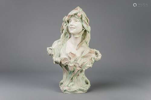 A polychrome decorated biscuit bust of a young lady,