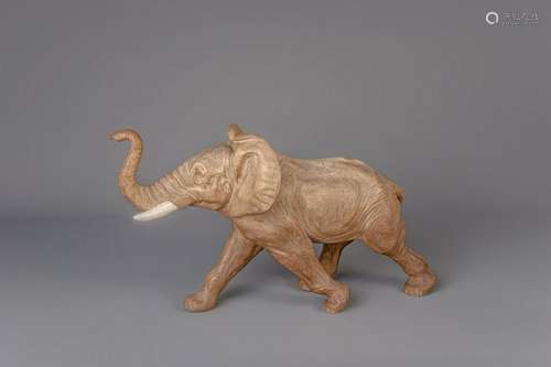 A polychrome decorated terracotta elephant, 20th C.