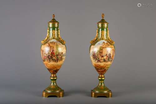 A pair of gold layered green ground decorative vases in