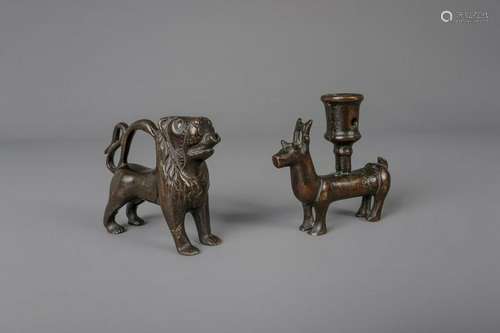 A copper alloy engraved lion shaped aquamanile and a