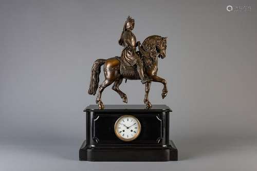 A black marble mantel clock with on top a patinated