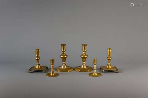 Three pairs of bronze and brass candlesticks, the Low