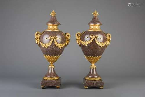 An imposing pair of gilt bronze mounted red marble