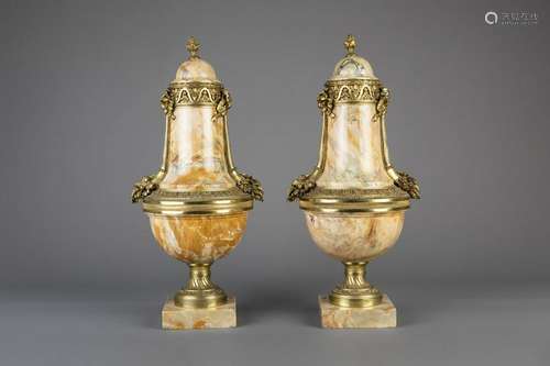 An imposing pair of gilt bronze mounted Rosalia marble