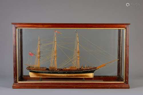 A painted wood model of the ship 'Alma' with glass