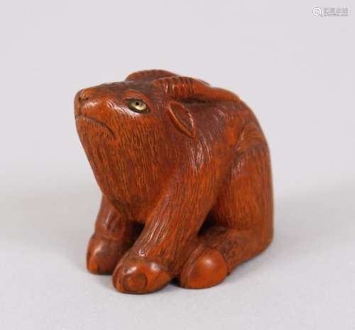 A LOVELY JAPANESE MEIJI PERIOD CARVED BOXWOOD / WOOD NETSUKE OF A GOAT, the goat in a seated