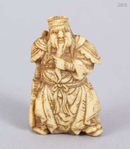 A LOVELY JAPANESE MEIJI PERIOD CARVED IVORY NETSUKE OF A KANU / CHINESE GENERAL, stood wearing