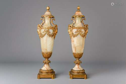 A pair of Neoclassical gilt bronze mounted green onyx