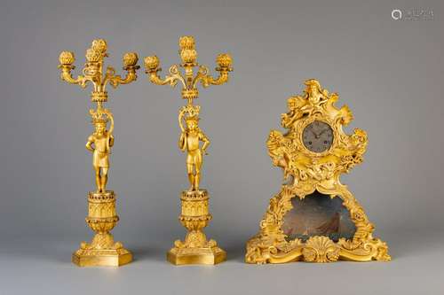 A gilt metal Poseidon mantel clock and a pair of Gothic