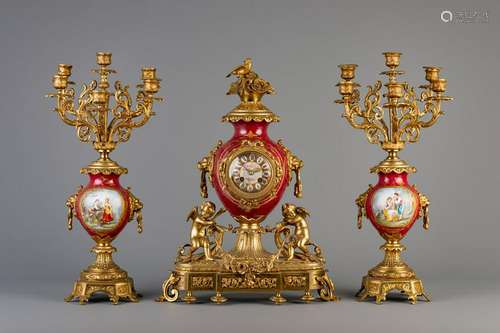 A three-piece gilt bronze mounted Sèvres style clock