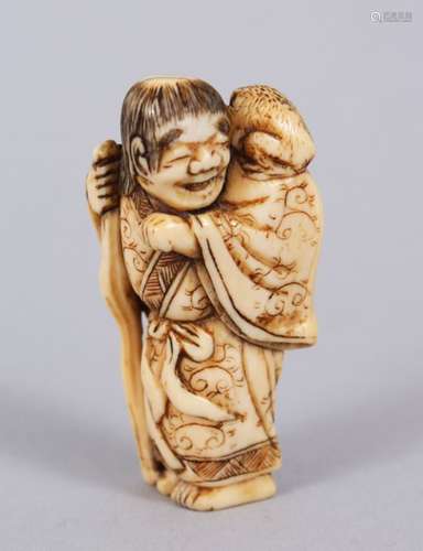 A LOVELY JAPANESE EDO PERIOD CARVED IVORY NETSUKE OF GAMMA SENNIN, stood with a toad upon his