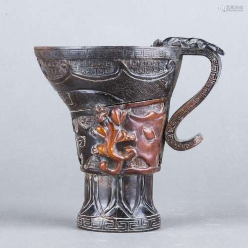 A CARVED HORN LIBATION CUP