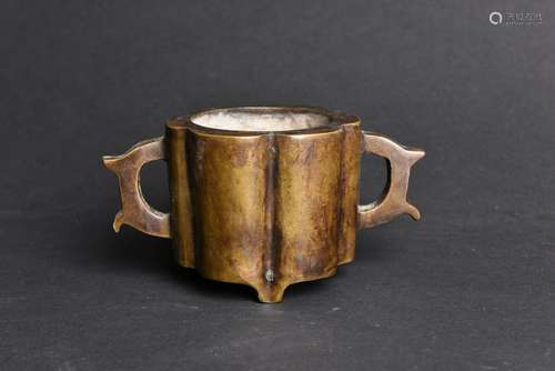 A BRONZE TRIPOD CENSER