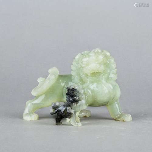 A GROUP OF TWO JADE LIONS