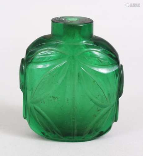 A 19TH / 20TH CENTURY CHINESE PEKING GREEN GLASS SNUFF BOTTLE, With carved decoration of foliage,