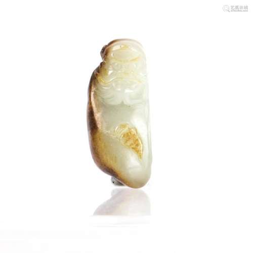 A  WHITE JADE CARVED OF FIGURE