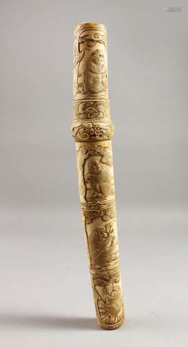 A GOOD JAPANESE MEIJI PERIO CARVED IVORY TANTO, the body carved with monkey decoration, 15ins long.