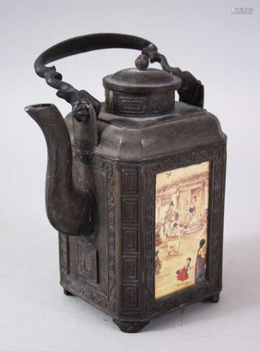 A CHINESE SOFT METAL TEA KETTLE, with four panels containing different landscape scenes, 20.3cm high