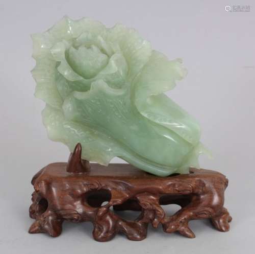 A 20TH CENTURY CHINESE CELADON BOWENITE HARDSTONE CARVING OF A LOTUS FLOWER, together with a