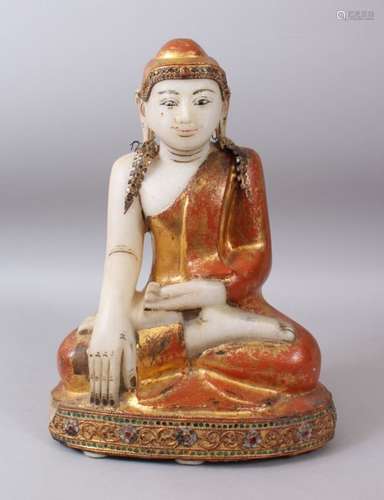 AN EARLY 20TH CENTURY BURMESE CARVED WHITE MARBLE SEATED BUDDHA with red ground and gilt