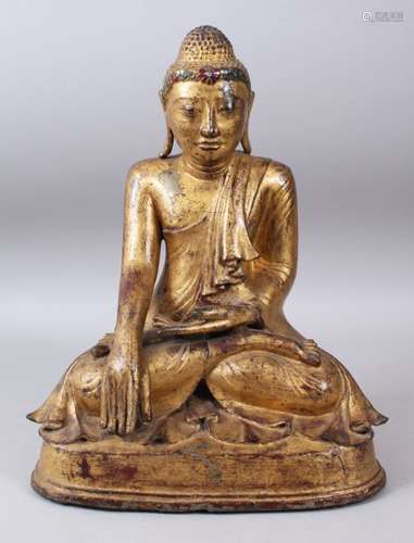 A BURMESE GILT BRONZE SEATED BUDDHA, possibly 18th Century, set with semi-precious stones. 40cms