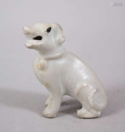 A CHINESE KANGXI BLANC DE CHINESE STYLE MODEL OF A HOUND, in a seated position with head to one