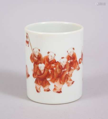 A CHINESE IRON RED PORCELAIN BRUSH POT WITH PARADING BOYS DECORATION, the iron decorated boys