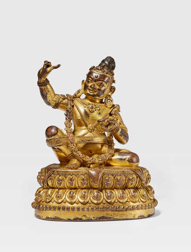 TIBET, 14TH/15TH CENTURY A GILT COPPER ALLOY FIGURE OF VIRUPA